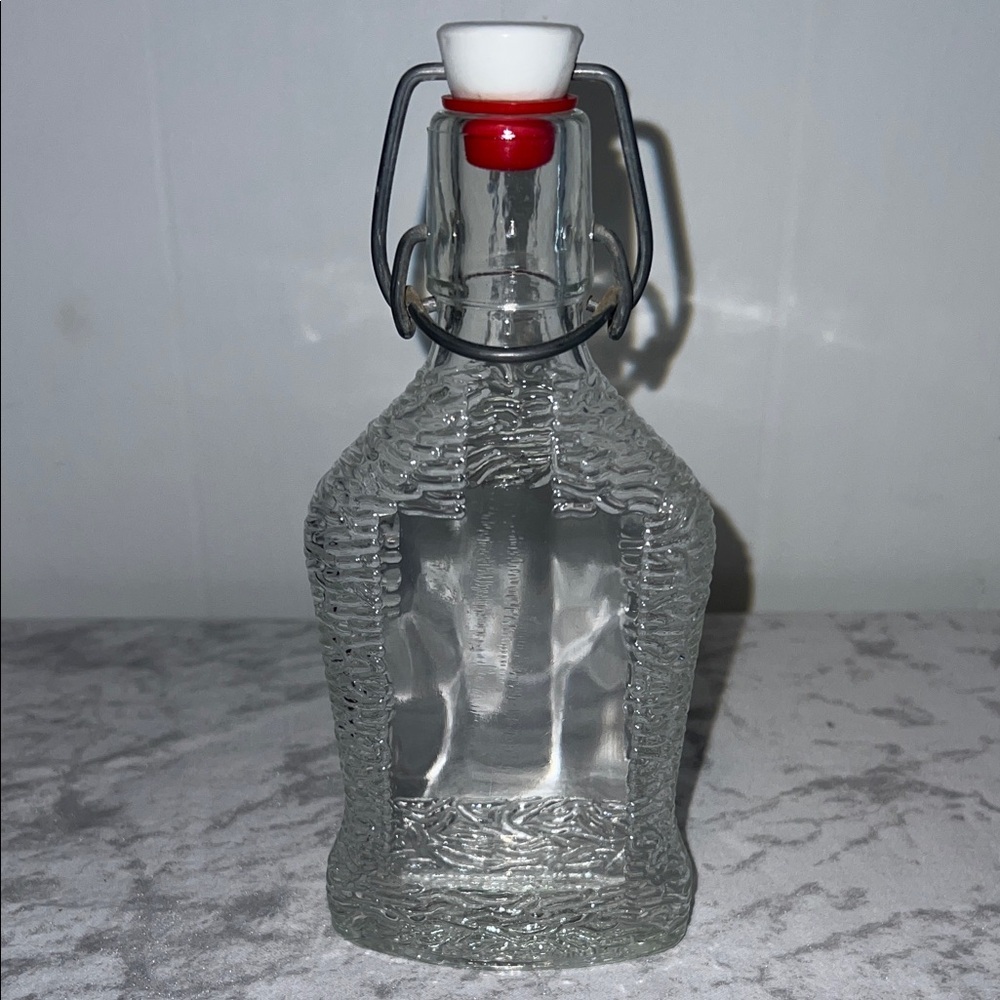 Clear Glass Liquor Bottle with Red and White Stopper From W Germany